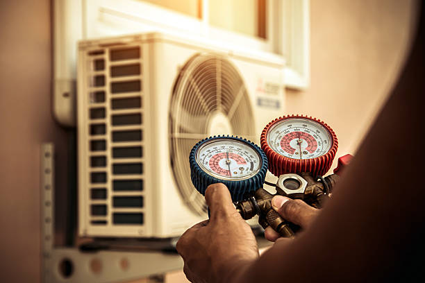 Professional Air Conditioning Service technician working in Maylene, AL